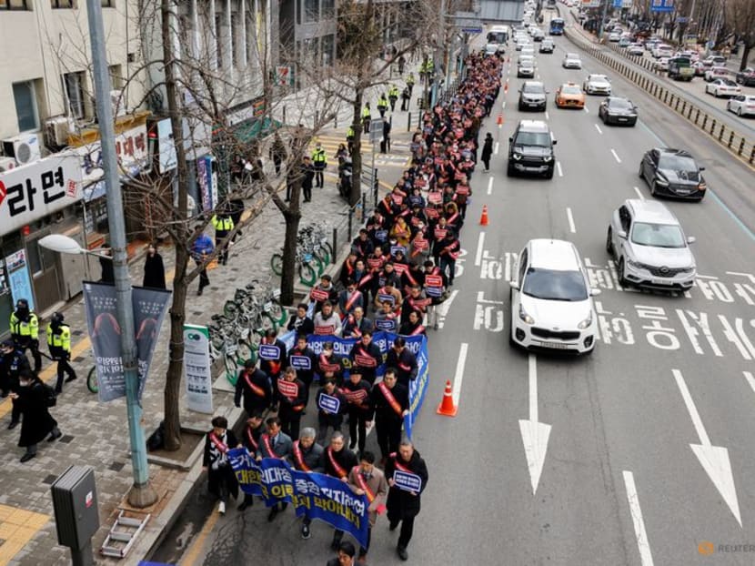 South Korean doctors march to the Presidential Office to protest against the government's medical policy in Seoul, South Korea, on Feb 25, 2024. South Korean doctors march to the Presidential Office to protest against the government's medical policy in Seoul, South Korea, on Feb 25, 2024.