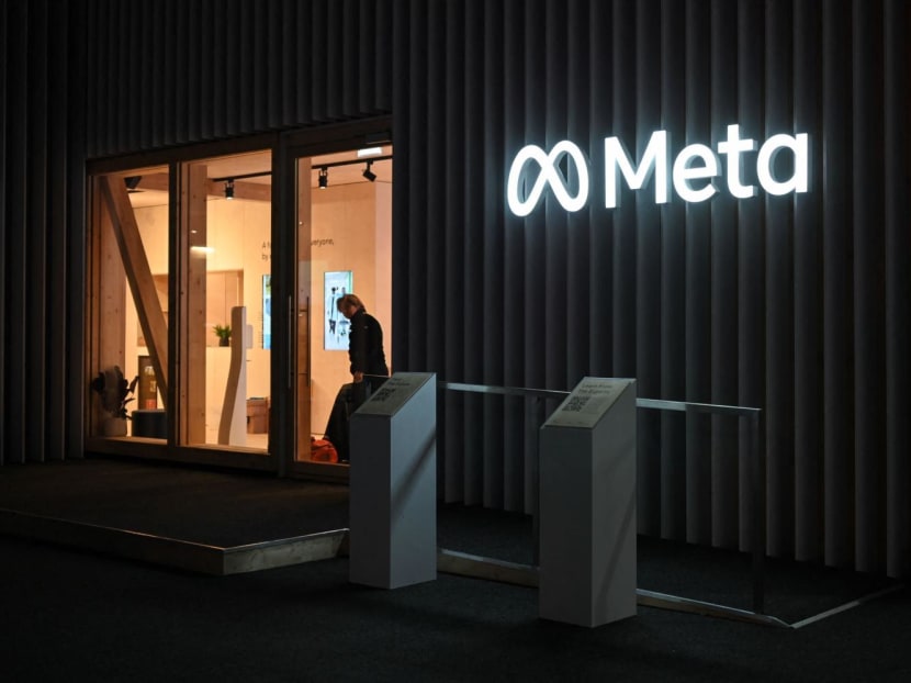 A man looks on near the stand of US multinational technology conglomerate Meta on May 22, 2022.
