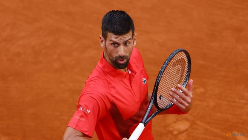 Djokovic saves set point, battles past Moutet to stay on course for record Grand Slam