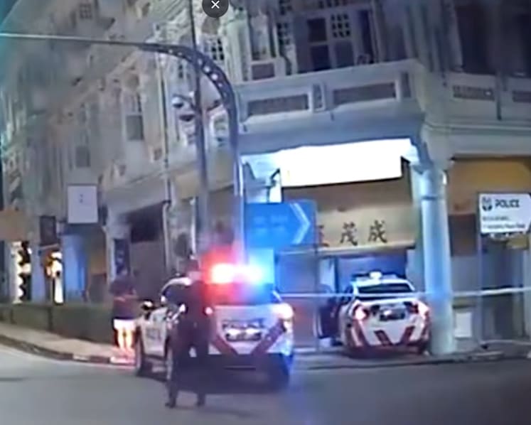Man arrested after his car collides with police vehicle, causing it to crash into shophouse entrance