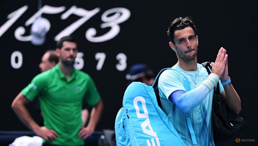 Djokovic gets out of jail and into Melbourne semis as injured Musetti forced to retire