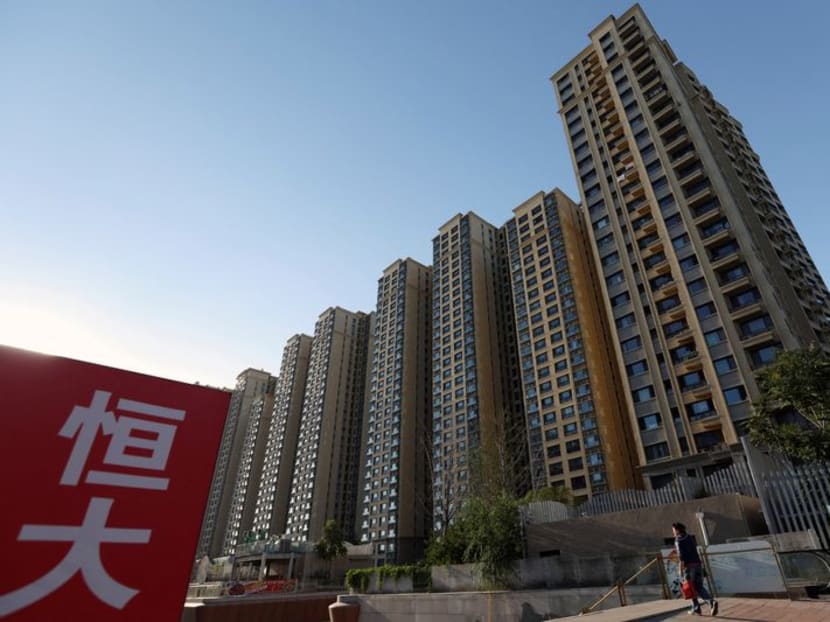 FILE PHOTO: An Evergrande sign is seen near residential buildings at an Evergrande residential complex in Beijing, China September 27, 2023. REUTERS/Florence Lo/File Photo
