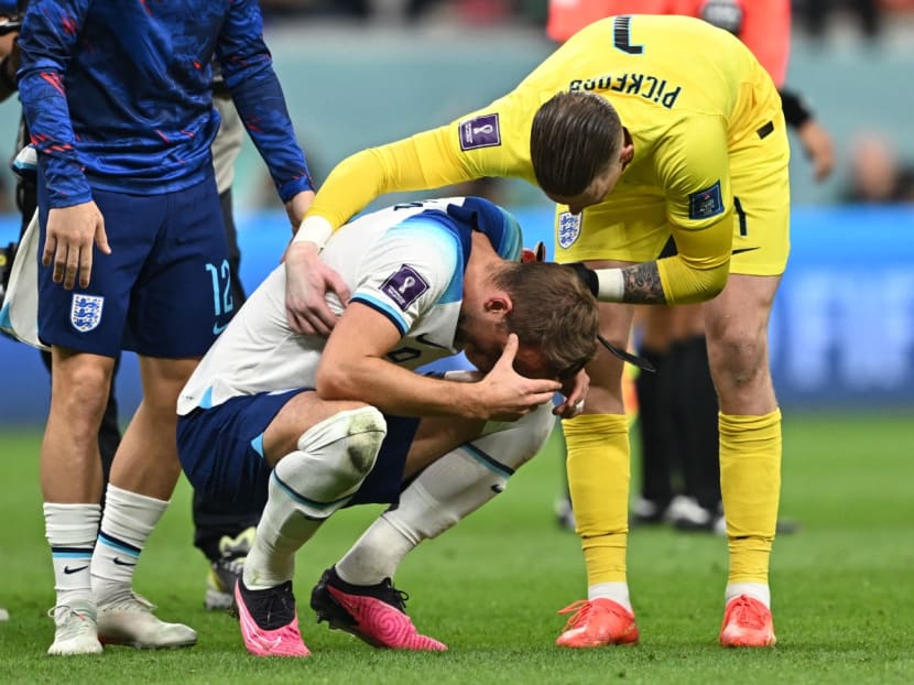 England's captain Harry Kane being consoled by goalkeeper Jordan Pickford at the end of the Qatar 2022 World Cup quarter-final football match between England and France at the Al-Bayt Stadium in Al Khor, north of Doha, on Dec 10, 2022. 