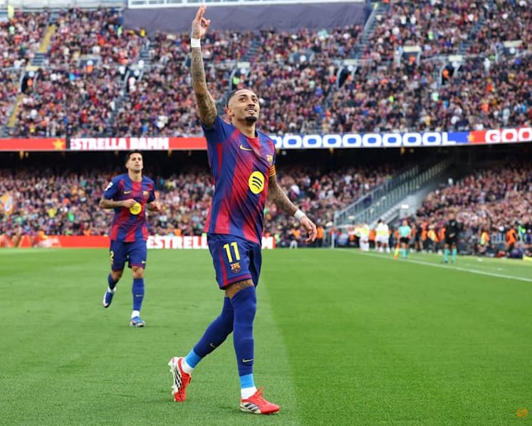 Raphinha hat-trick fires Barcelona past Sevilla to stay top