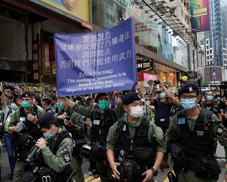 Hong Kong police patrol against protests on China holiday