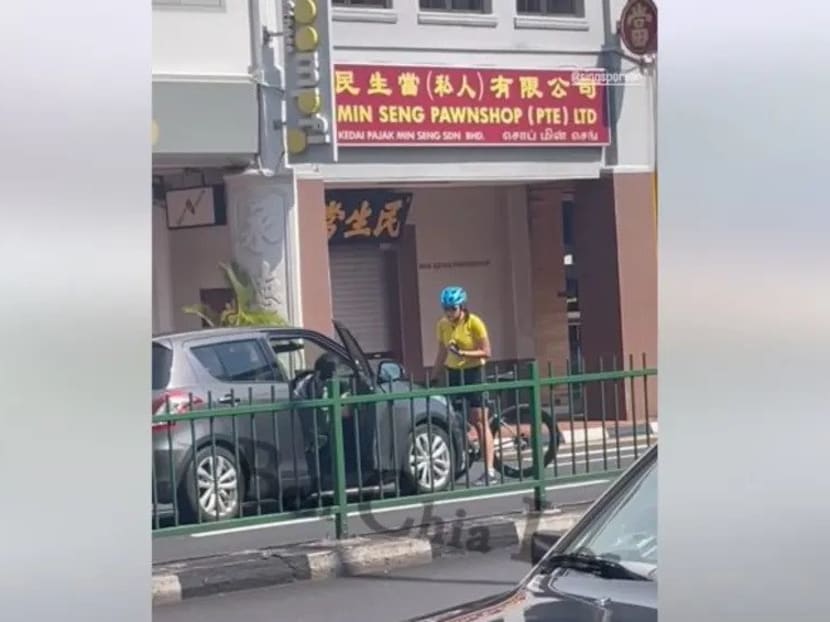 In a screengrab from a video clip posted on Facebook, a cyclist and a car driver were allegedly involved in an argument while obstructing traffic along East Coast Road.