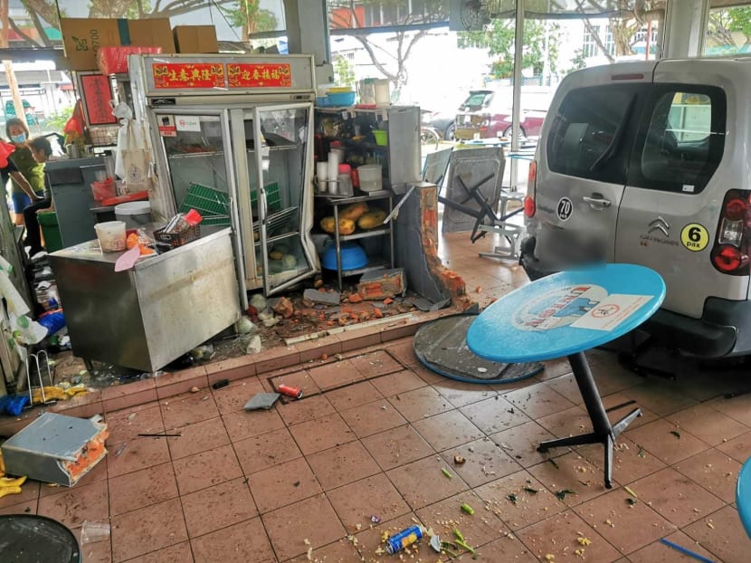 The van reversed more than 5m into the coffee shop, smashing through a brick divider and pinning a woman at a fruit stall that she was tending, an eyewitness said. The van reversed more than 5m into the coffee shop, smashing through a brick divider and pinning a woman at a fruit stall that she was tending, an eyewitness said.