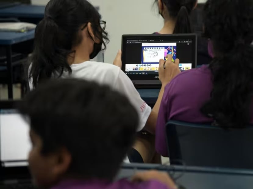 Secondary 2 students with their personal learning devices during a Mathematics lesson at Jurong West Secondary School. Secondary 2 students with their personal learning devices during a Mathematics lesson at Jurong West Secondary School.