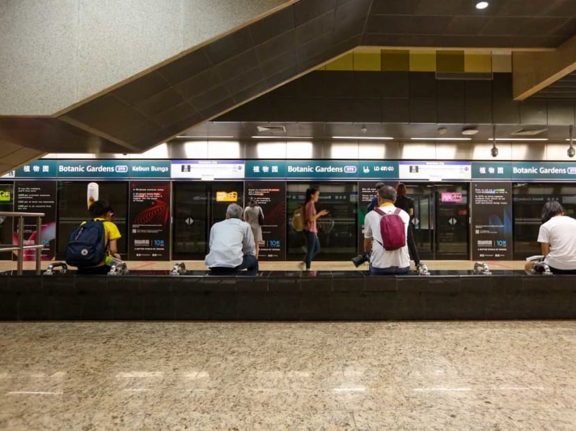 Commuters passing through Botanic Gardens MRT Station on March 23, 2020.