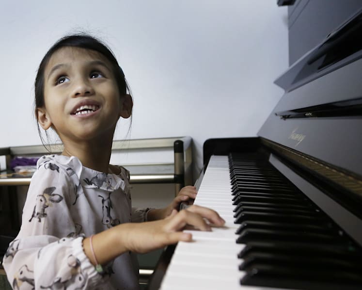 Anisah, the blind keyboard player who brings joy and laughter to her family