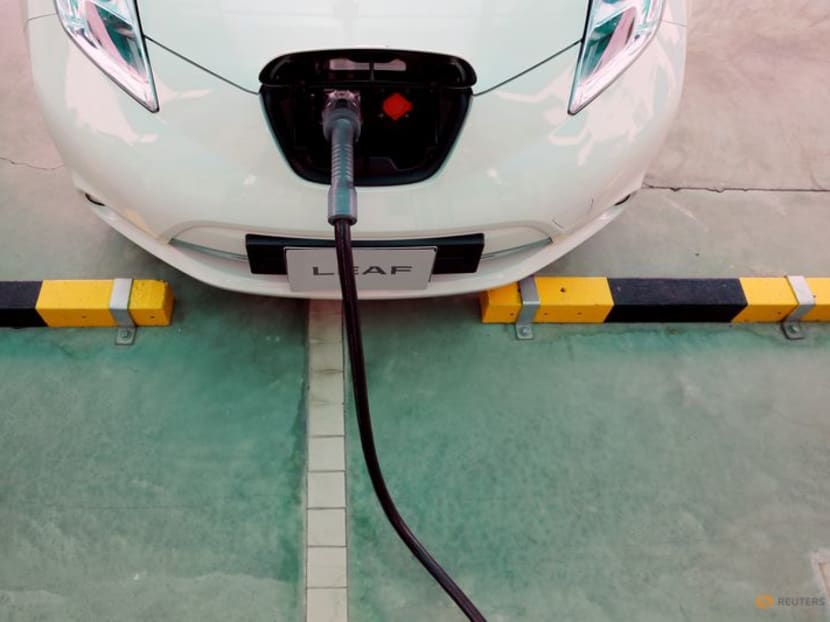 FILE PHOTO: An electric car is seen while being charged during the opening of a PTT Pcl energy firm's commercial EV (Electric Vehicle) charging station, in Bangkok, Thailand, August 15, 2016. REUTERS/Jorge Silva/File Photo