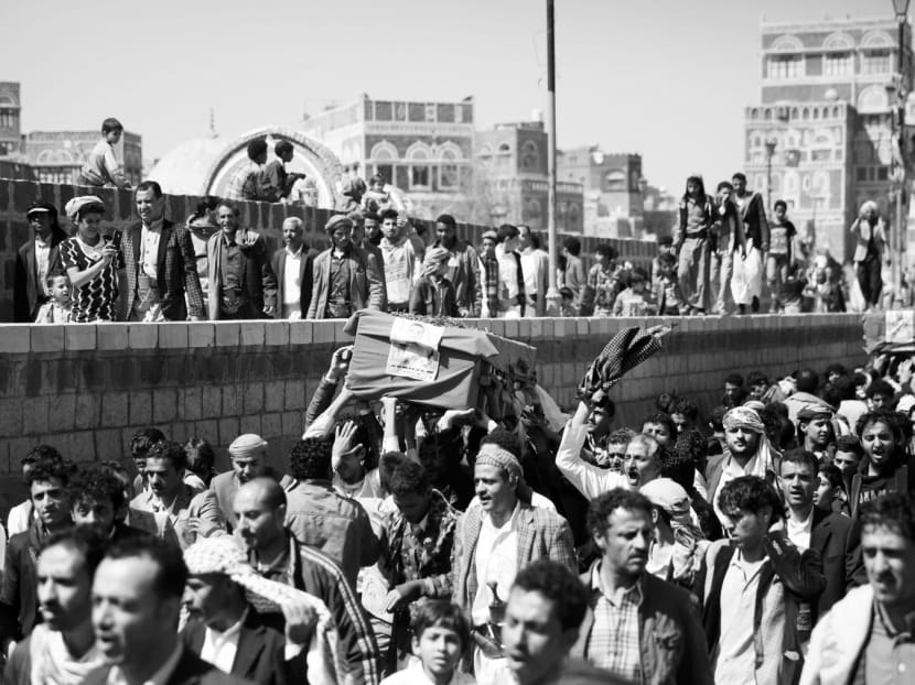 People carrying coffins of men who were killed in the recent Saudi-led airstrikes during a funeral in the Old City of Sanaa, Yemen on Jan 28. The strike was one of US President Donald Trump’s attempts to eradicate militants ‘from the face of the earth’. Photo: AP