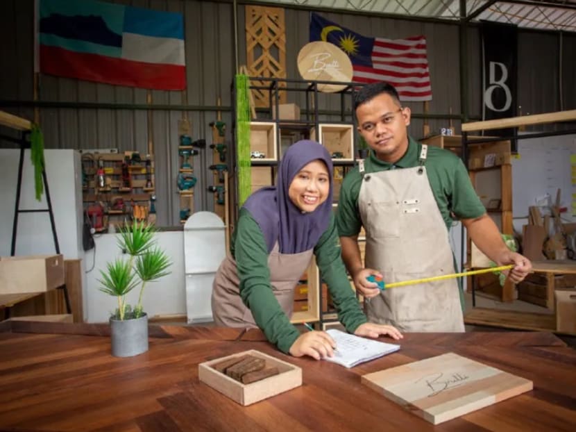 Brutti & Besi manager Lukman Awaluddin, 29, with his wife Siti Faznur Abd Khaleq, 33.