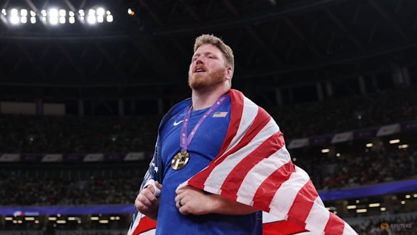 Injury-ravaged Crouser wins astounding third shot gold