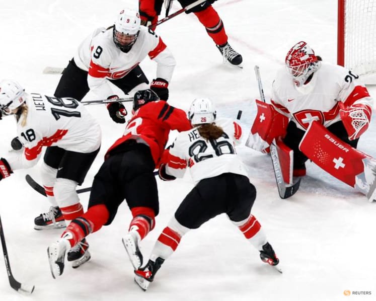 Ice hockey-Canada look to captain Poulin in title defence after goal-scoring record