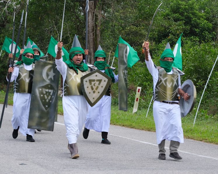 Islamic party in Malaysia under probe after members stage march with fake swords, spears and shields