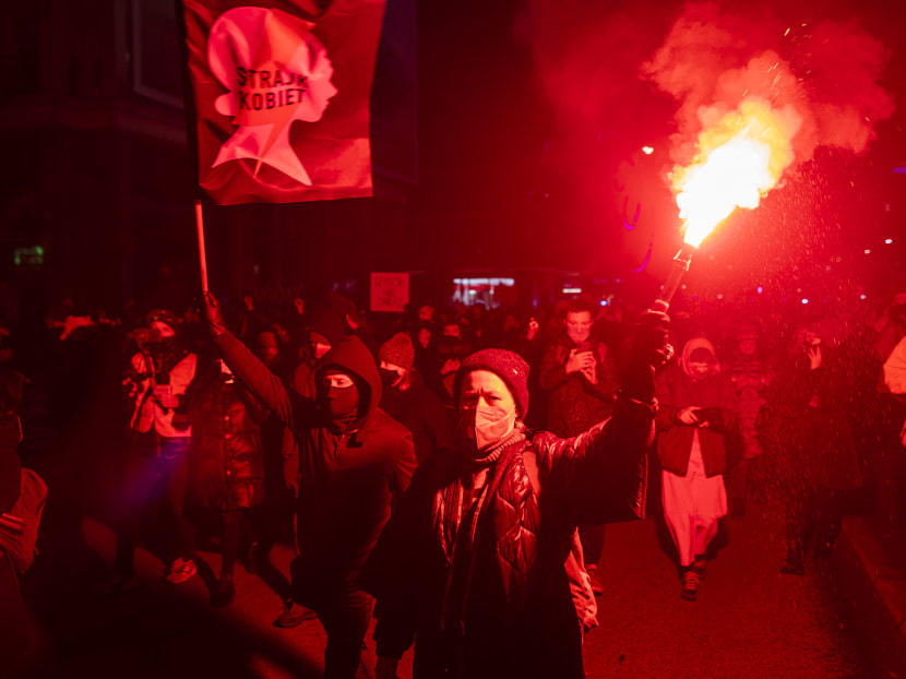 Demonstrators take part in a pro-choice protest in the center of Warsaw on Jan 27, 2021, as part of a nationwide wave of protests against Poland's near-total ban on abortion. The banner reads "Abortion on demand".