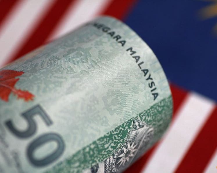 Analysis: Ringgit's record-breaking decline could trigger public unhappiness, spell political trouble for Malaysia PM Anwar