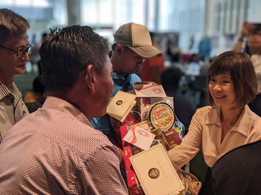 Senior Minister of State for the Environment and Water Resources Amy Khor (right) attending an appreciation event for environmental services workers at Republic Polytechnic on March 11, 2020.