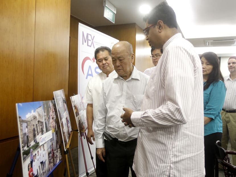 Mr Tan Thiam Lye (left), chairman of the Singapore Taoist Federation, and Mr Lee Bock Guan, president of the Singapore Buddhist Lodge, with Mohamed Nassir, managing director of SimplyIslam.sg for Aid To Syrian Refugees in Turkey on Aug 7. Photo: Wee Teck Hian