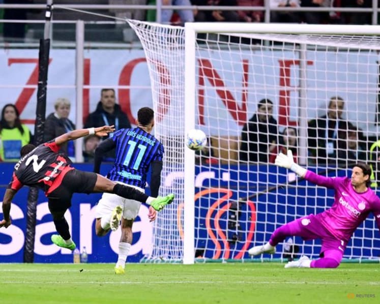 Milan edge Inter in derby to keep distant title chase alive