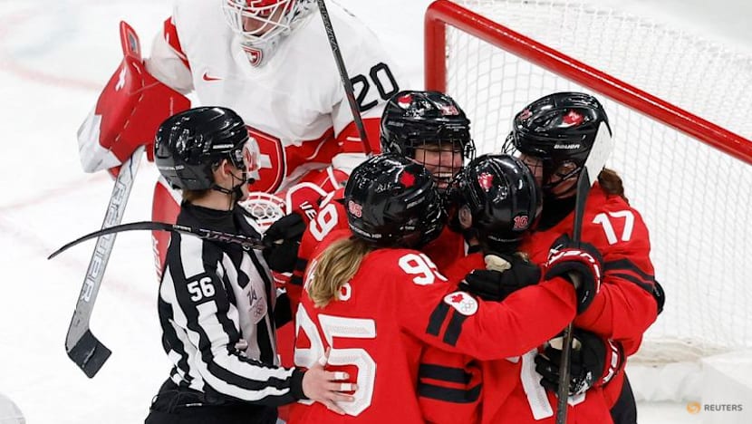 Ice hockey-Canada look to captain Poulin in title defence after goal-scoring record