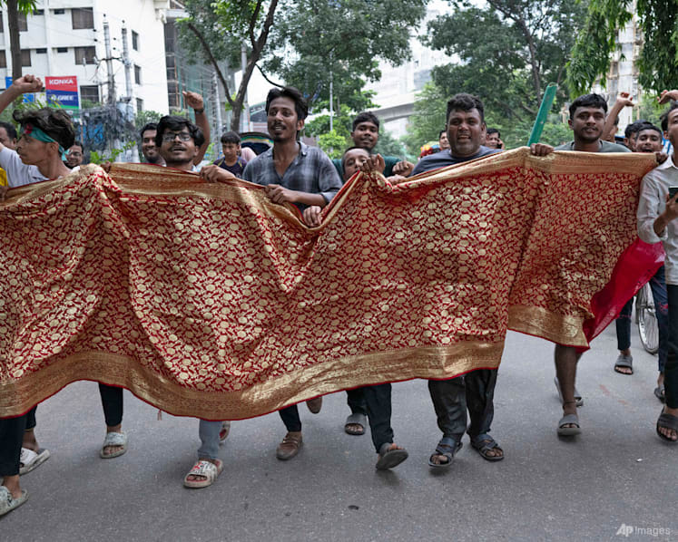 PHOTOS: Bangladesh protesters celebrate as prime minister resigns and flees abroad