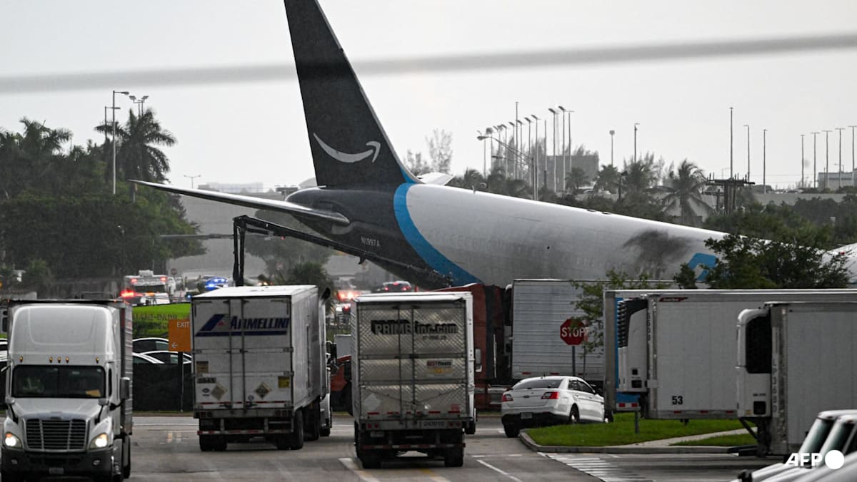 Amazon cargo plane overshoots Miami runway, hits vehicles, catches fire
