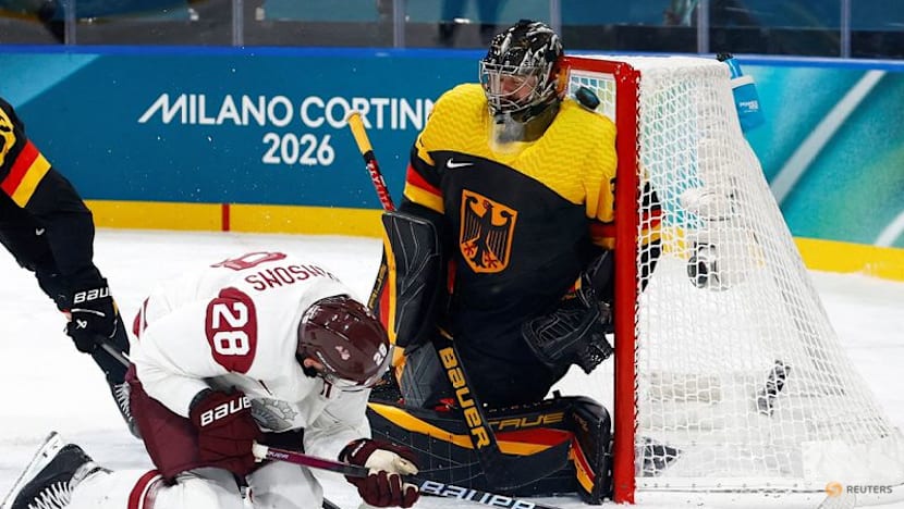 Ice hockey-Sweden hold off Slovakia, Latvia beat Germany