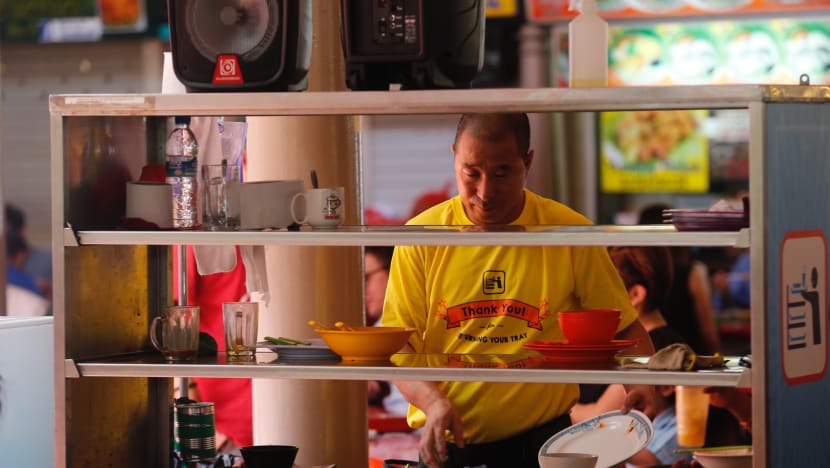 More customers returning trays at two hawker centres, thanks to personal reminders and visual cues