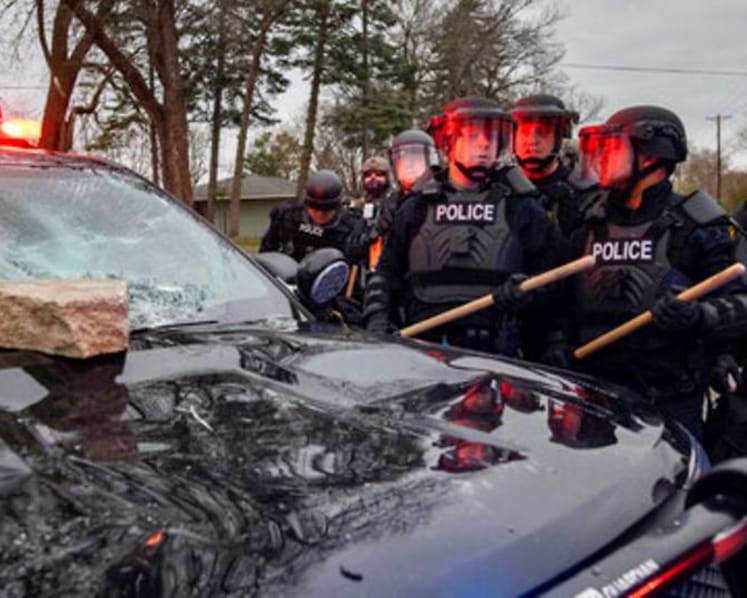 How does an officer use a gun instead of a Taser?