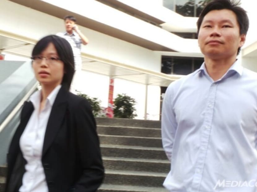 File photo of NParks assistant director Bernard Lim (right) outside court. Photo: Channel NewsAsia