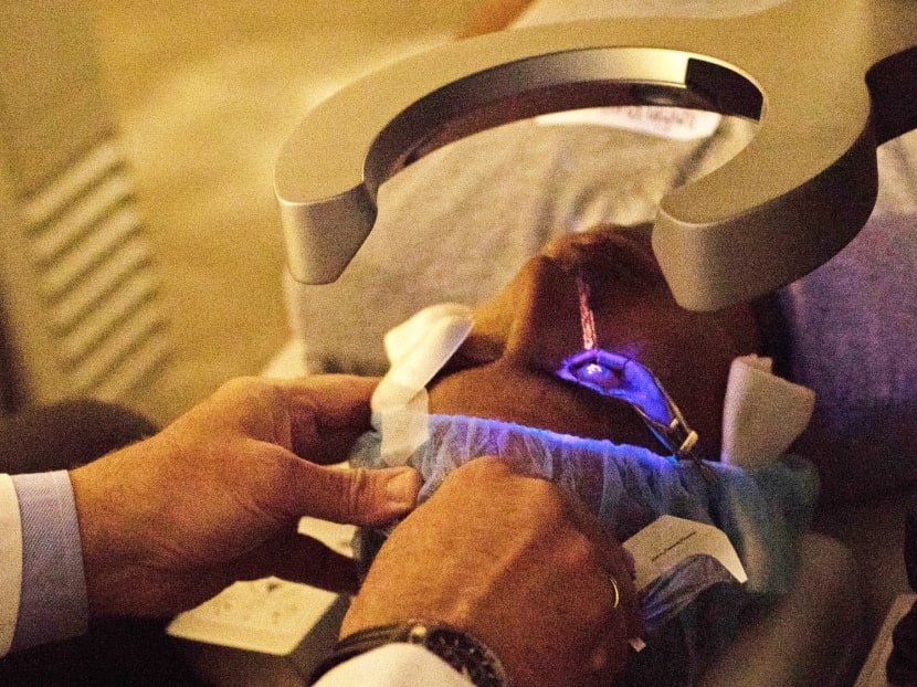 Mr Justin Puglisi undergoing Lasik eye surgery at Ophthalmic Consultants of Long Island in Garden City, New York. The 15-minute procedure was performed 700,000 times last year.