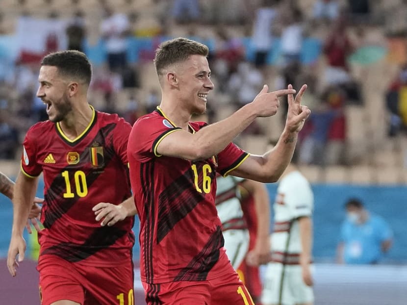 Belgium's midfielder Thorgan Hazard celebrates after scoring the first goal during the Uefa Euro 2020 round of 16 football match between Belgium and Portugal at La Cartuja Stadium in Seville on June 27, 2021.