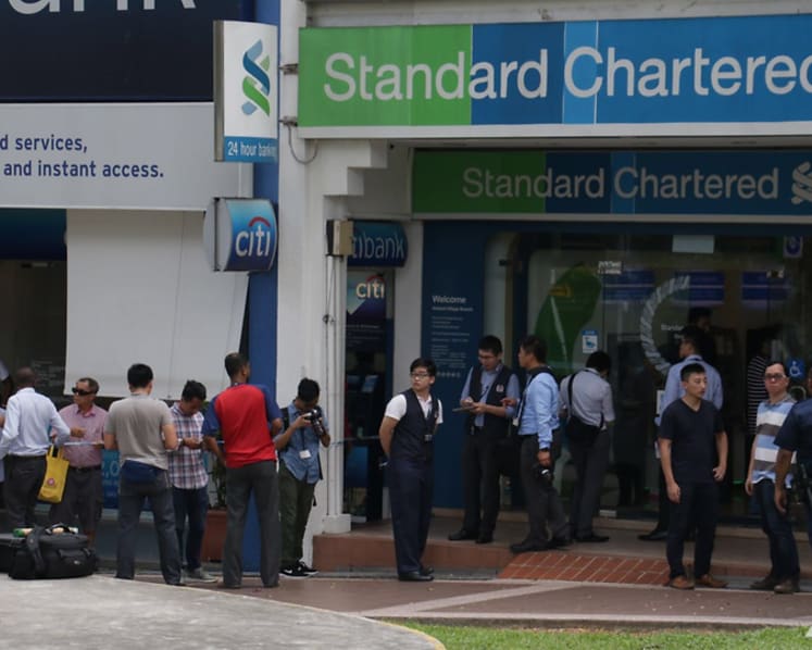 Manhunt for Standard Chartered bank robber at Holland Village