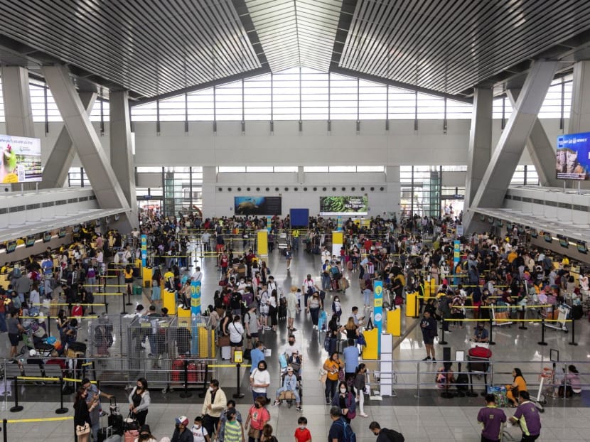 Passengers queue at airline counters in the Ninoy Aquino International Airport, in Pasay City, Metro Manila, Philippines on Jan 2, 2023. Passengers queue at airline counters in the Ninoy Aquino International Airport, in Pasay City, Metro Manila, Philippines on Jan 2, 2023.