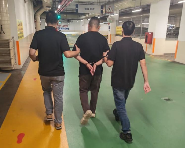 Two mobile phone shop employees arrested over scheme to compromise Singpass accounts Two mobile phone shop employees arrested over scheme to compromise Singpass accounts