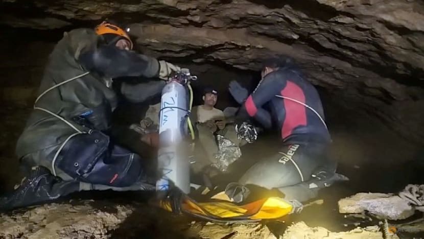 Rescuers seek new route to two missing in Laos cave