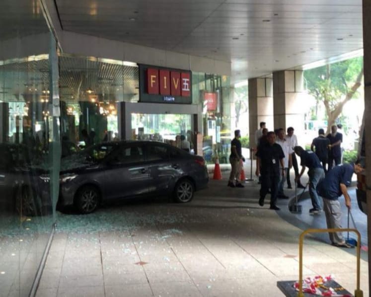 Car mounts kerb, crashes into glass facade at Great Eastern Centre; one person taken to SGH
