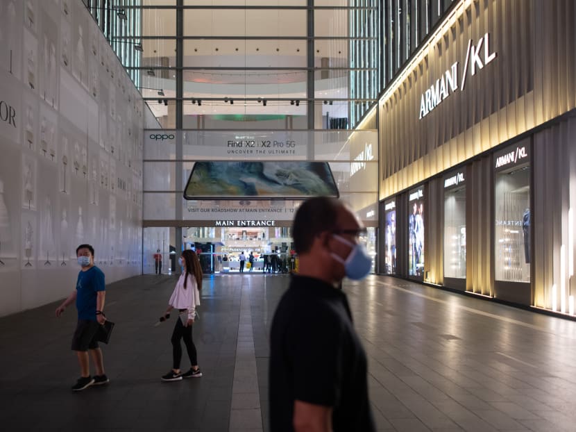 Shoppers wearing facemasks walk in the near-deserted Pavilion shopping mall on the eve of Malaysia's lockdown on travel amid fears over the spread of Covid-19 in Kuala Lumpur on March 17, 2020. Shoppers wearing facemasks walk in the near-deserted Pavilion shopping mall on the eve of Malaysia's lockdown on travel amid fears over the spread of Covid-19 in Kuala Lumpur on March 17, 2020.