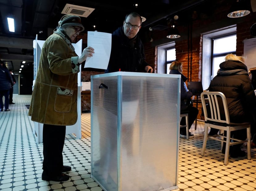 People cast their ballots at a polling station during the presidential election in Moscow, Russia on March 15, 2024. People cast their ballots at a polling station during the presidential election in Moscow, Russia on March 15, 2024.