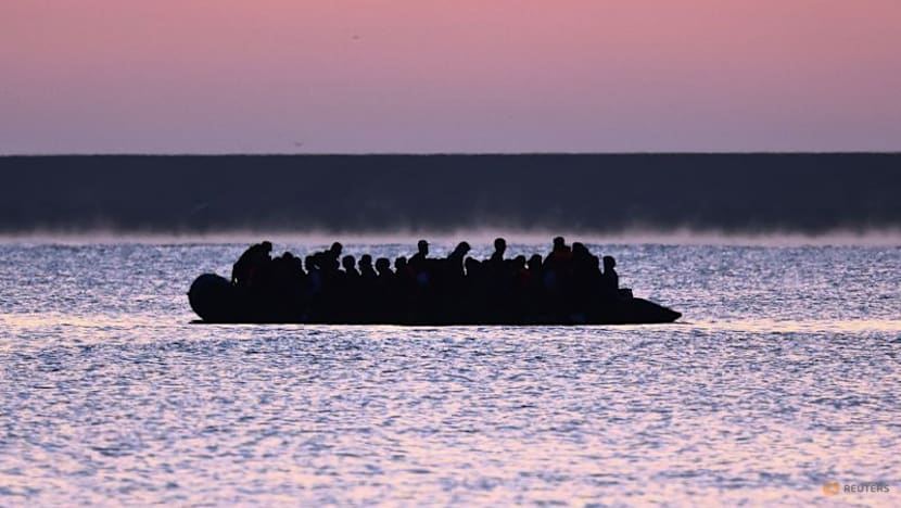 UK sends 26 migrants to France, takes 18 under 'in-out' deal