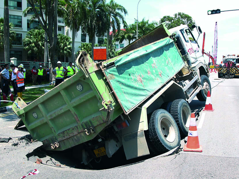 Truck sinks into ground along Upper Changi Road East