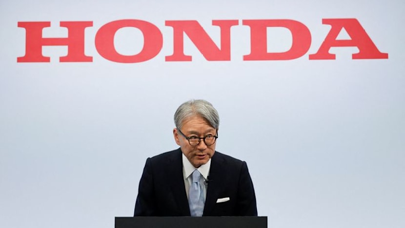 Honda CEO apologises for company's loss, wins investor backing at annual meeting