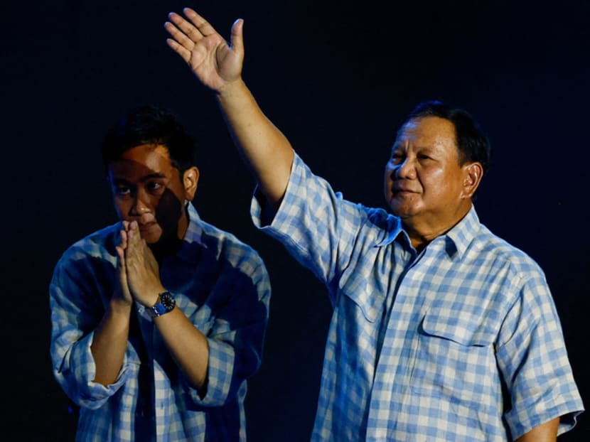 Presidential candidate Prabowo Subianto (right) gesturing to his supporters next to his vice-presidential running mate Gibran Rakabuming Raka, as Mr Prabowo claims victory after unofficial vote counts during an event to watch the election results in Jakarta on Feb 14, 2024. Presidential candidate Prabowo Subianto (right) gesturing to his supporters next to his vice-presidential running mate Gibran Rakabuming Raka, as Mr Prabowo claims victory after unofficial vote counts during an event to watch the election results in Jakarta on Feb 14, 2024.