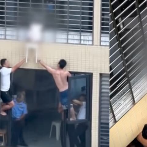 惊险！三岁女童头卡防护网 悬空12楼外