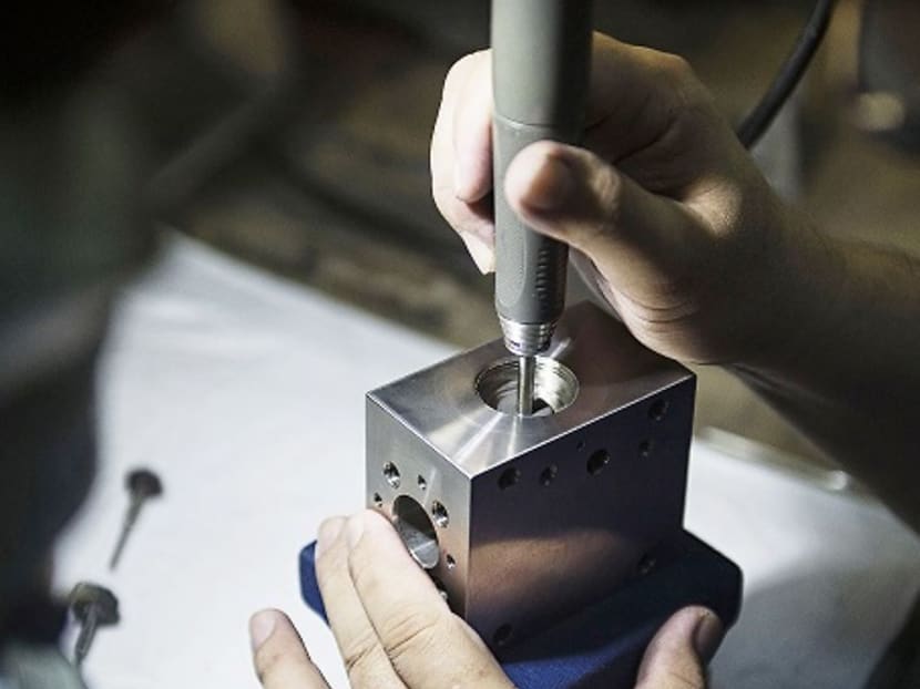 Singapore's manufacturing output growth dips slightly to 14.6% in November Singapore's manufacturing output growth dips slightly to 14.6% in November