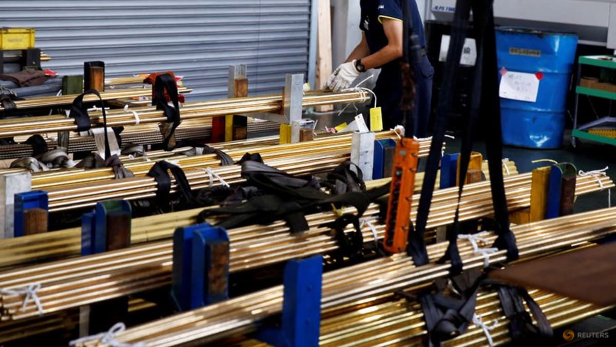 Japan says its economy likely to mark first positive output gap in 7 years