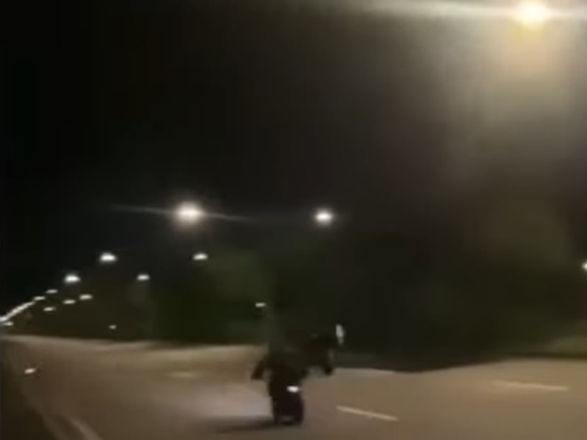 A screengrab from a video clip showing riders of power-assisted bicycles racing each other on an empty stretch of road. A screengrab from a video clip showing riders of power-assisted bicycles racing each other on an empty stretch of road.