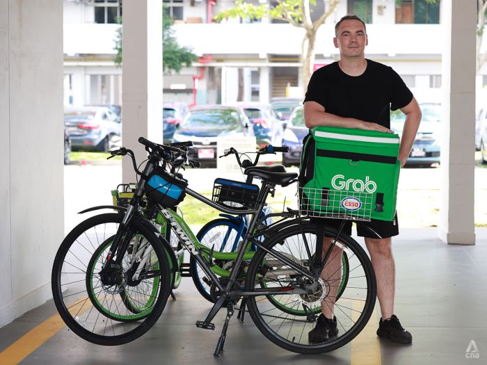 The expat who raised S$7,000 in 11 months doing food deliveries in his free time and donated it all to charity